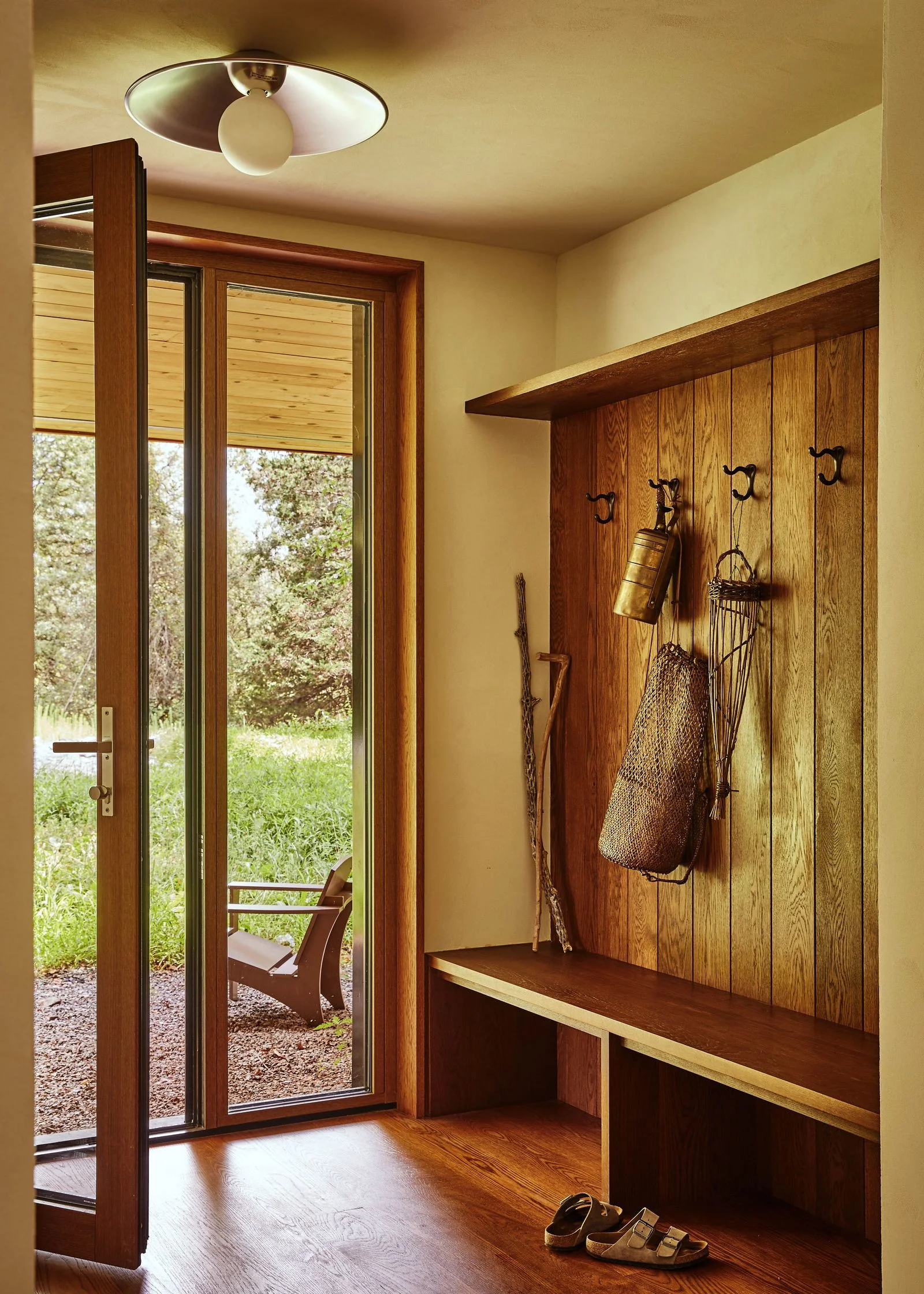 Image may contain Indoors Interior Design Door Wood Hardwood Stained Wood Chair and Furniture