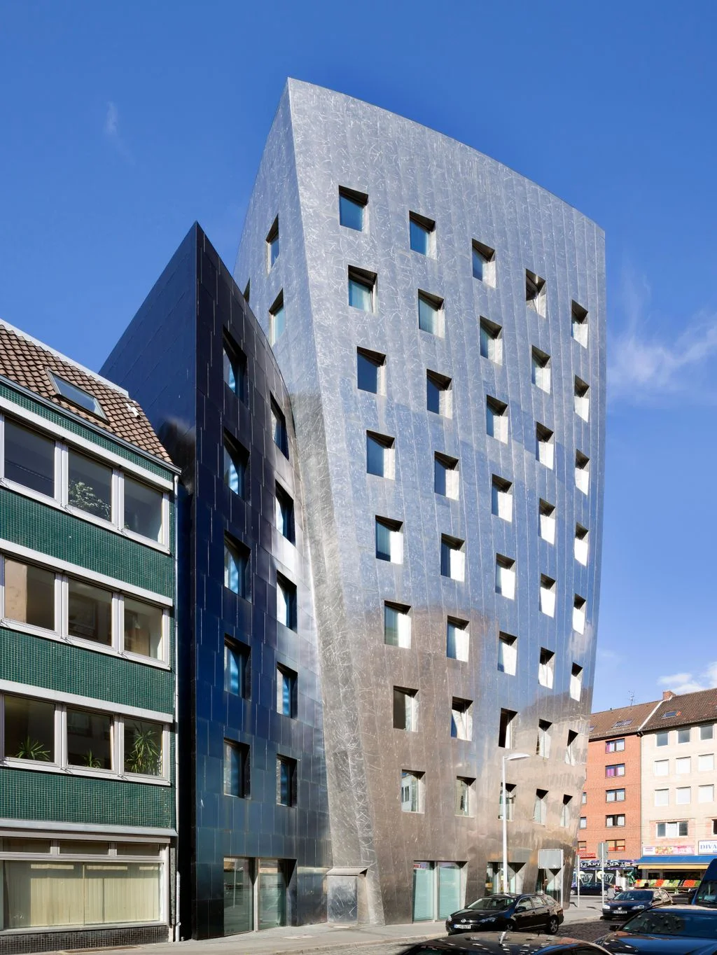 tall silver building on a street in Germany