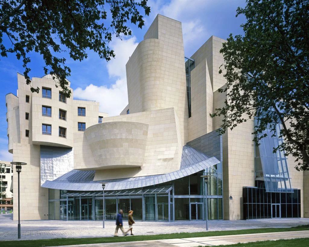 modern building with two people walking in front of it