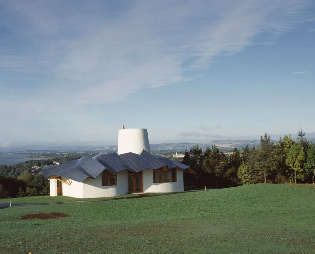 modern building by itself in a field