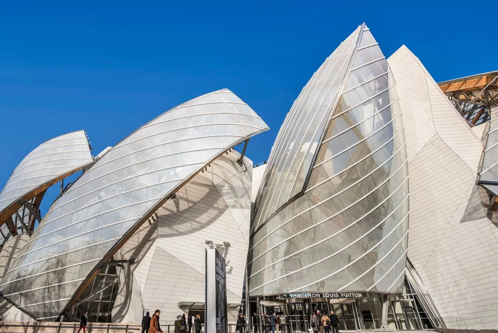 exterior of a modern building that looks like a group of sails