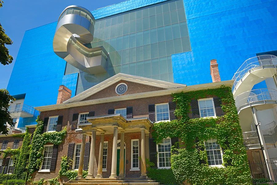 one classical building infront of a modern building