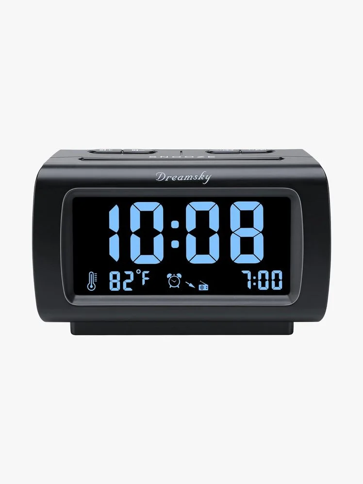 Black digital alarm clock with blue numbers on the screen.