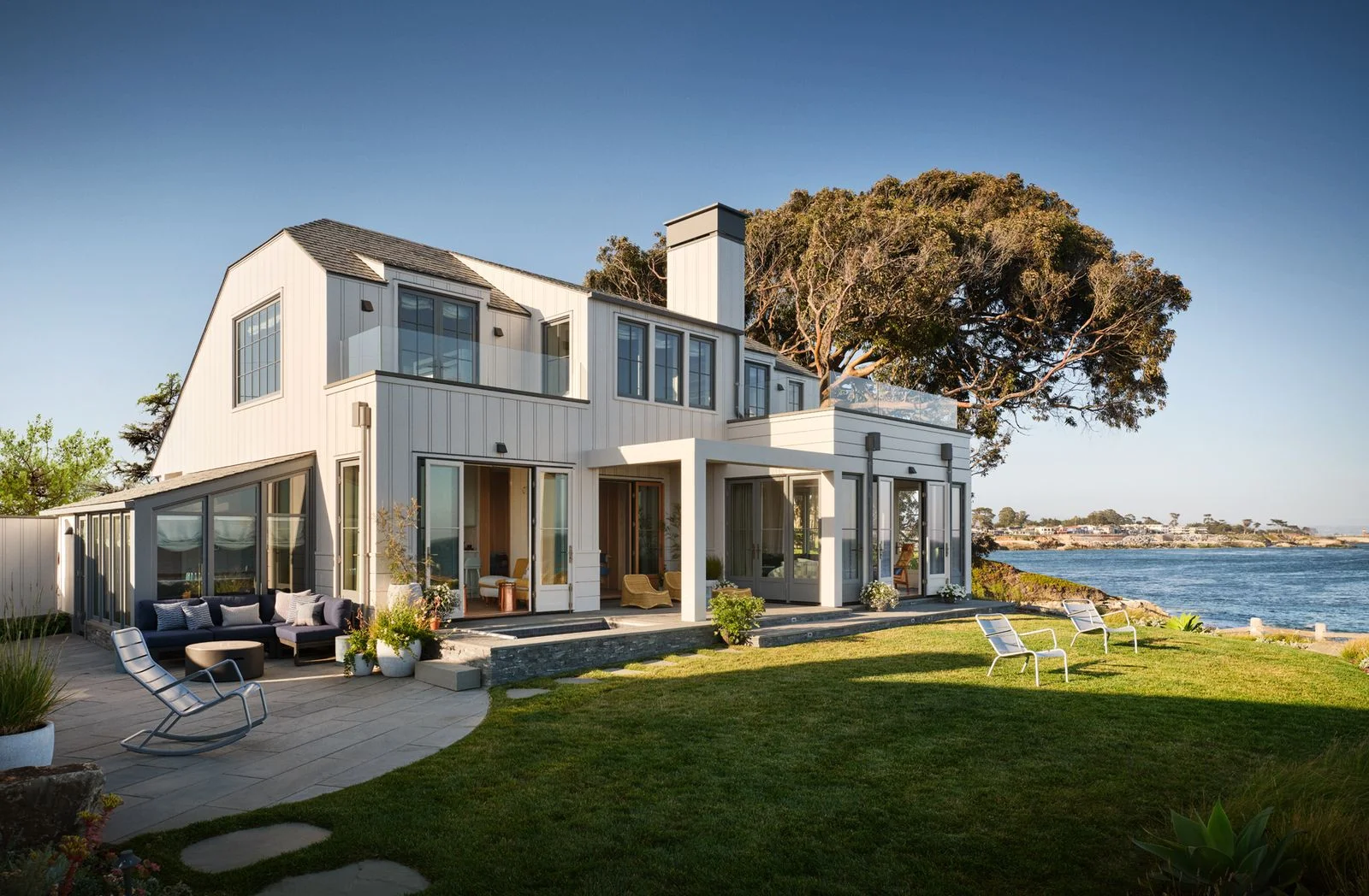 Image may contain Architecture Building Housing House Portico Plant Chair Furniture and Door