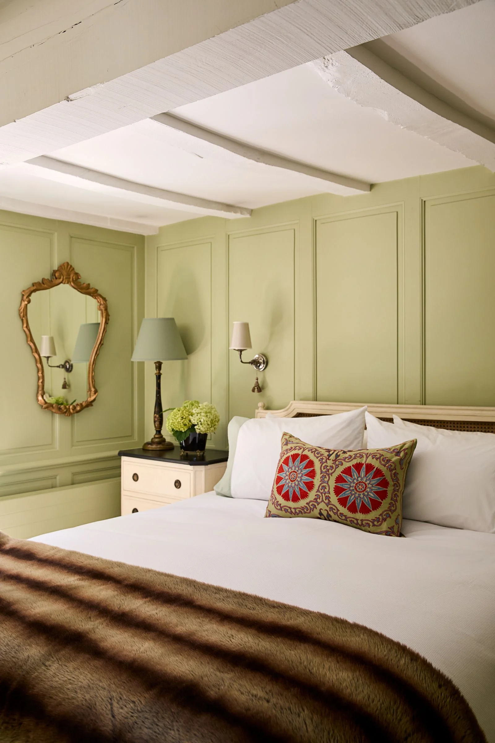 Image may contain Cushion Home Decor Corner Lamp Indoors Interior Design Bed Furniture Pillow Bedroom and Room