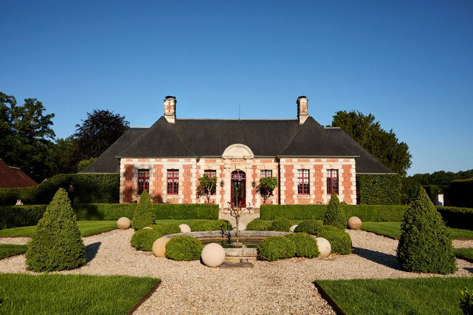 Image may contain Architecture Building Housing House Manor Plant and Outdoors