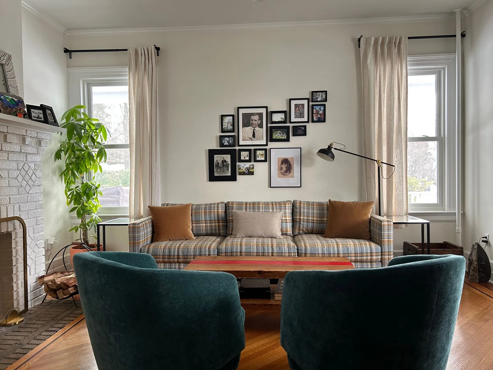 Image may contain Couch Furniture Home Decor Architecture Building Indoors Living Room Room Person and Art