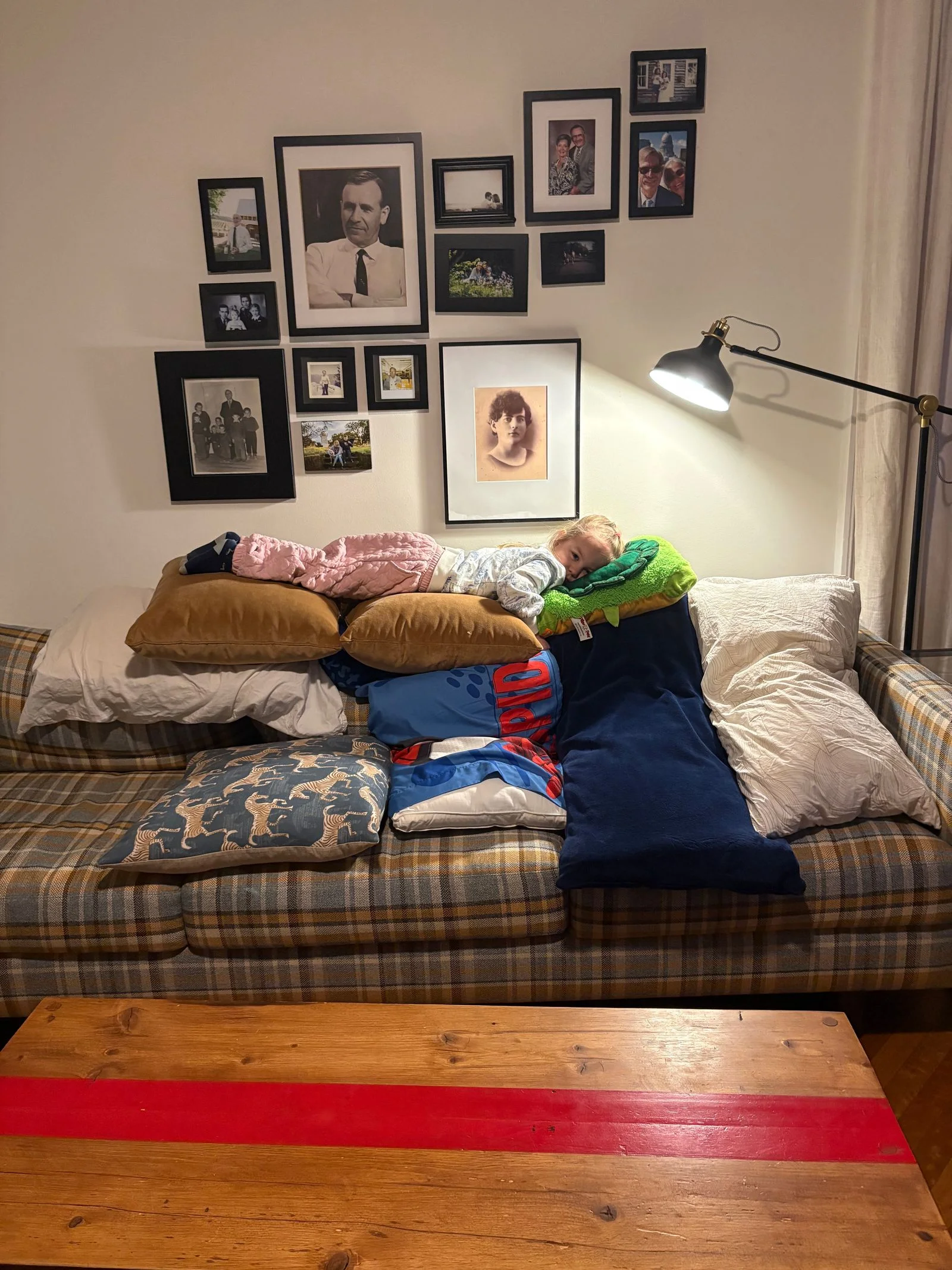 Image may contain Couch Furniture Cushion Home Decor Person Architecture Building Indoors Living Room and Room