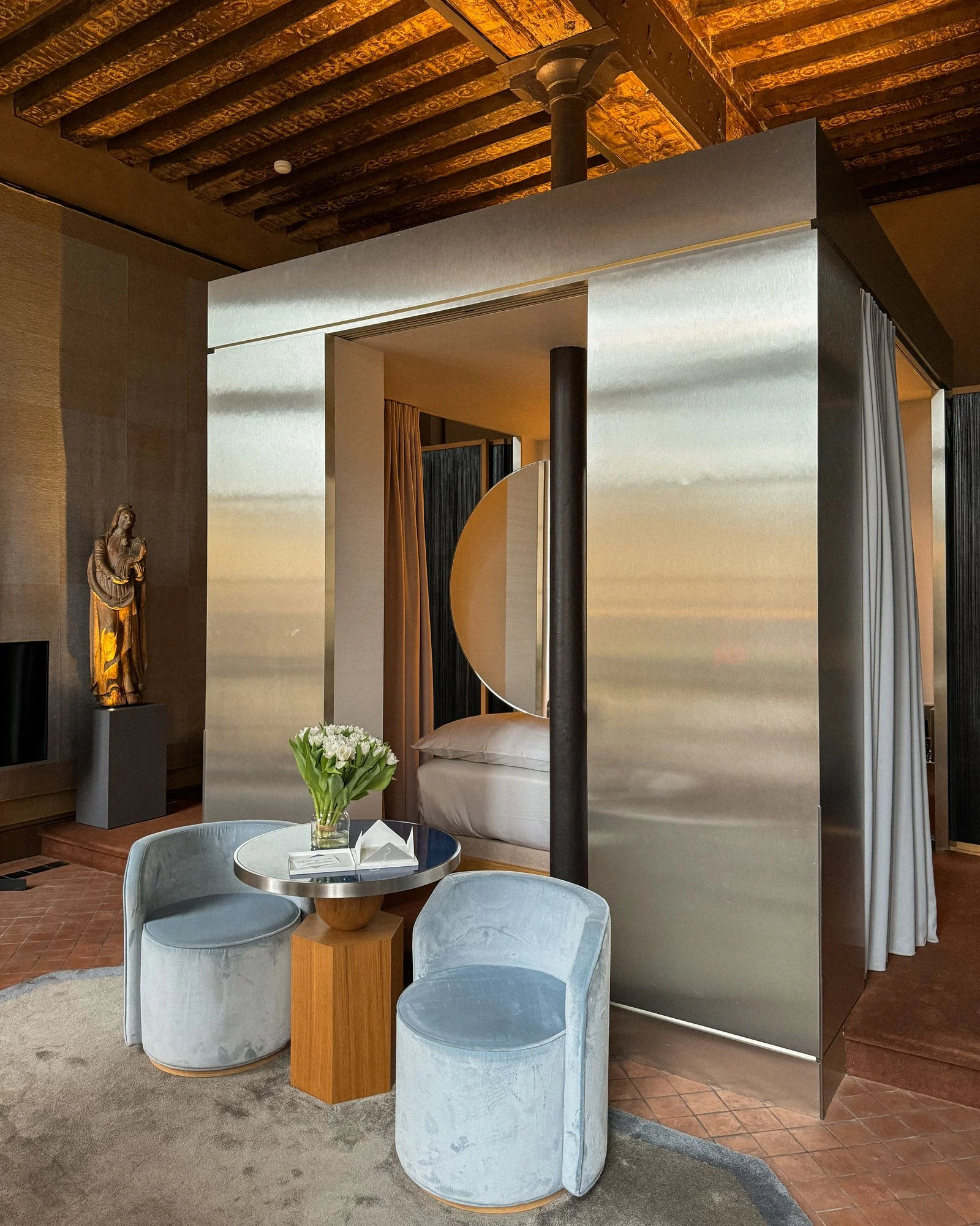 Image may contain Indoors Furniture Person Bed Bedroom Room and Interior Design