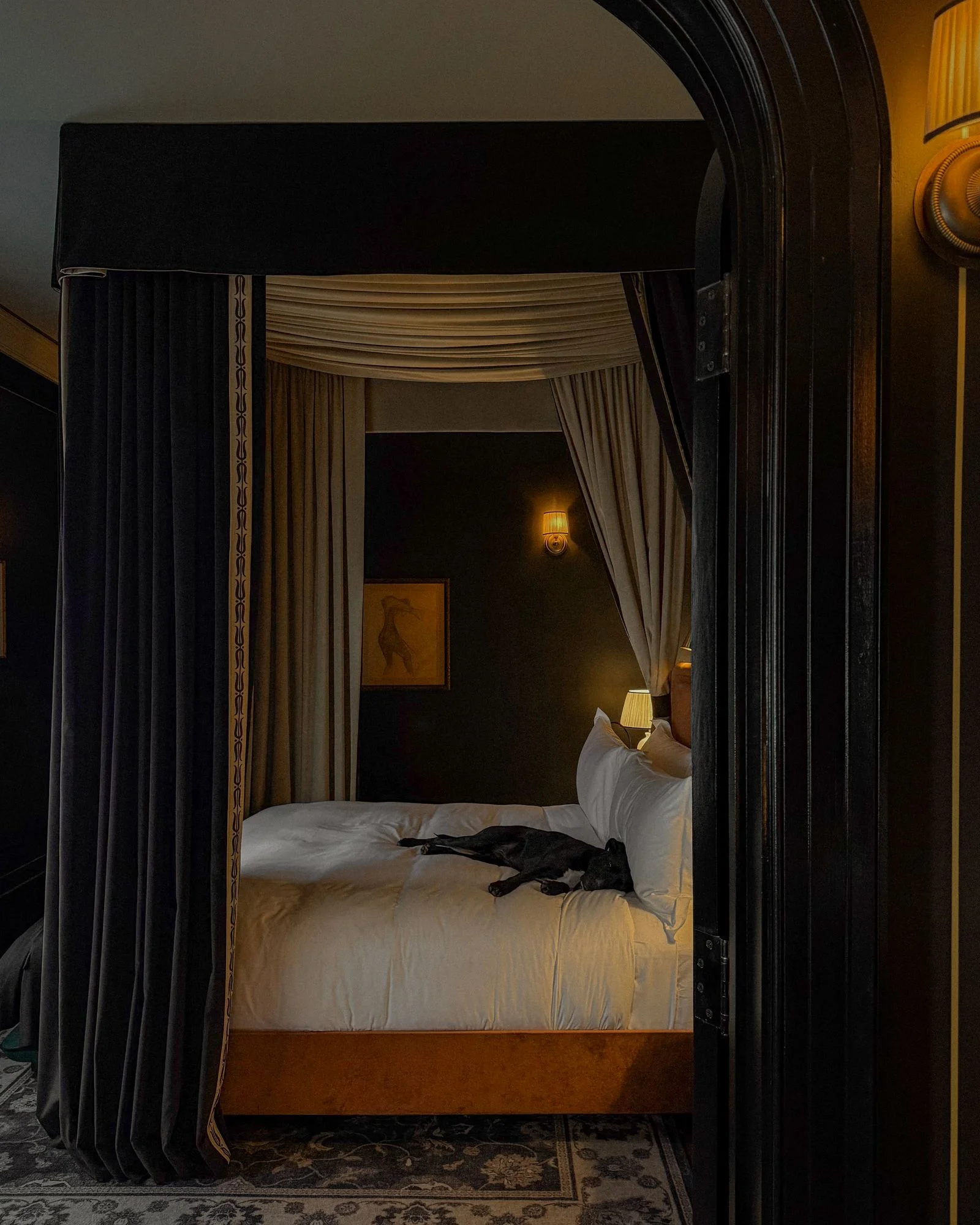 Image may contain Furniture Bed Bedroom Indoors Room Home Decor Rug Canopy Bed Lamp Art Painting and Accessories