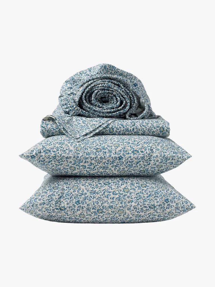 Image may contain: Cushion, Home Decor, Pillow, Clothing, Hat, and Coat