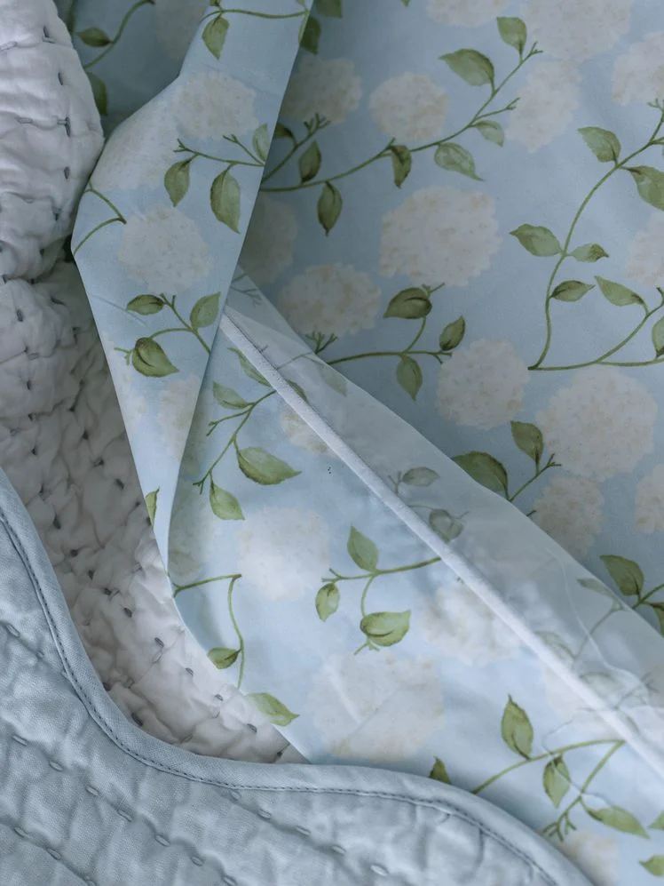 Image may contain: Blanket, Plant, Home Decor, and Quilt