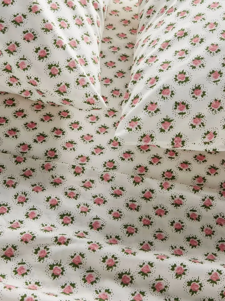 Image may contain: Blanket, Quilt, and Furniture