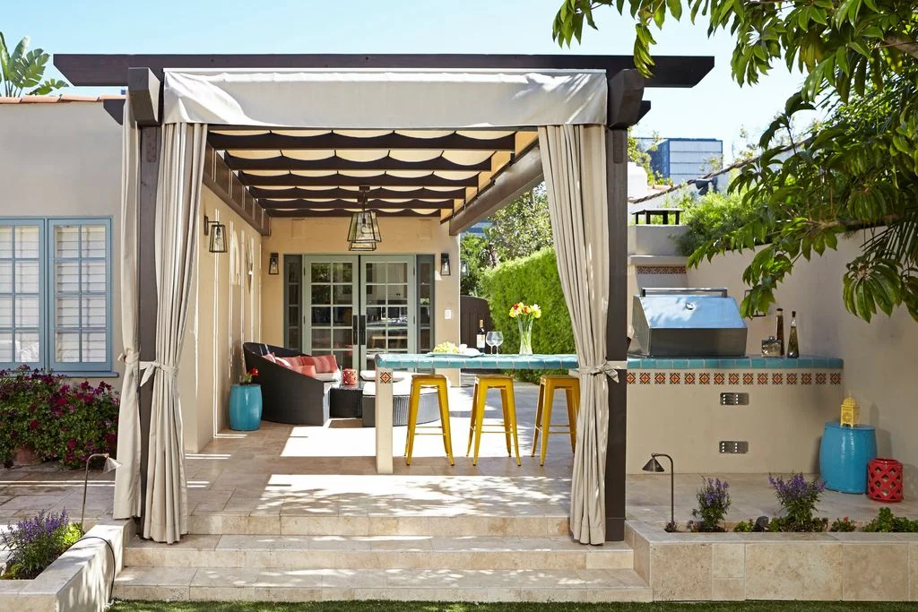 Image may contain Architecture Building House Housing Porch Patio Indoors Interior Design Pergola and Couch