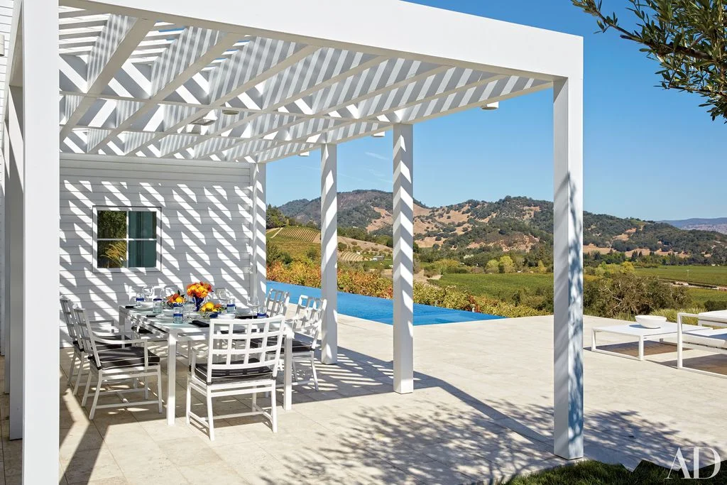 Image may contain Porch Patio Pergola Furniture and Chair