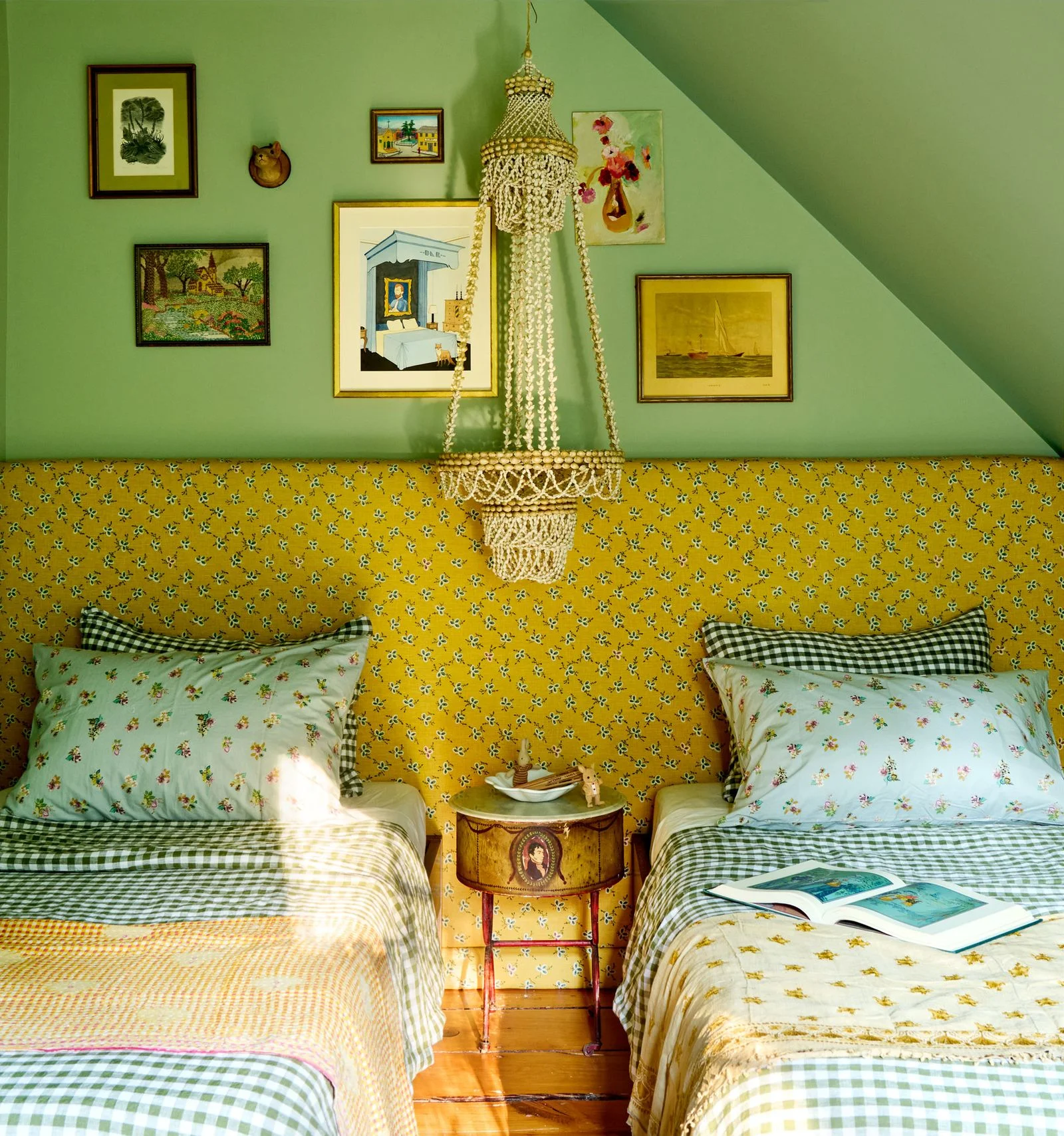 Image may contain Chandelier Lamp Home Decor Cushion Furniture Bed Bedroom Indoors Room Dorm Room and Couch