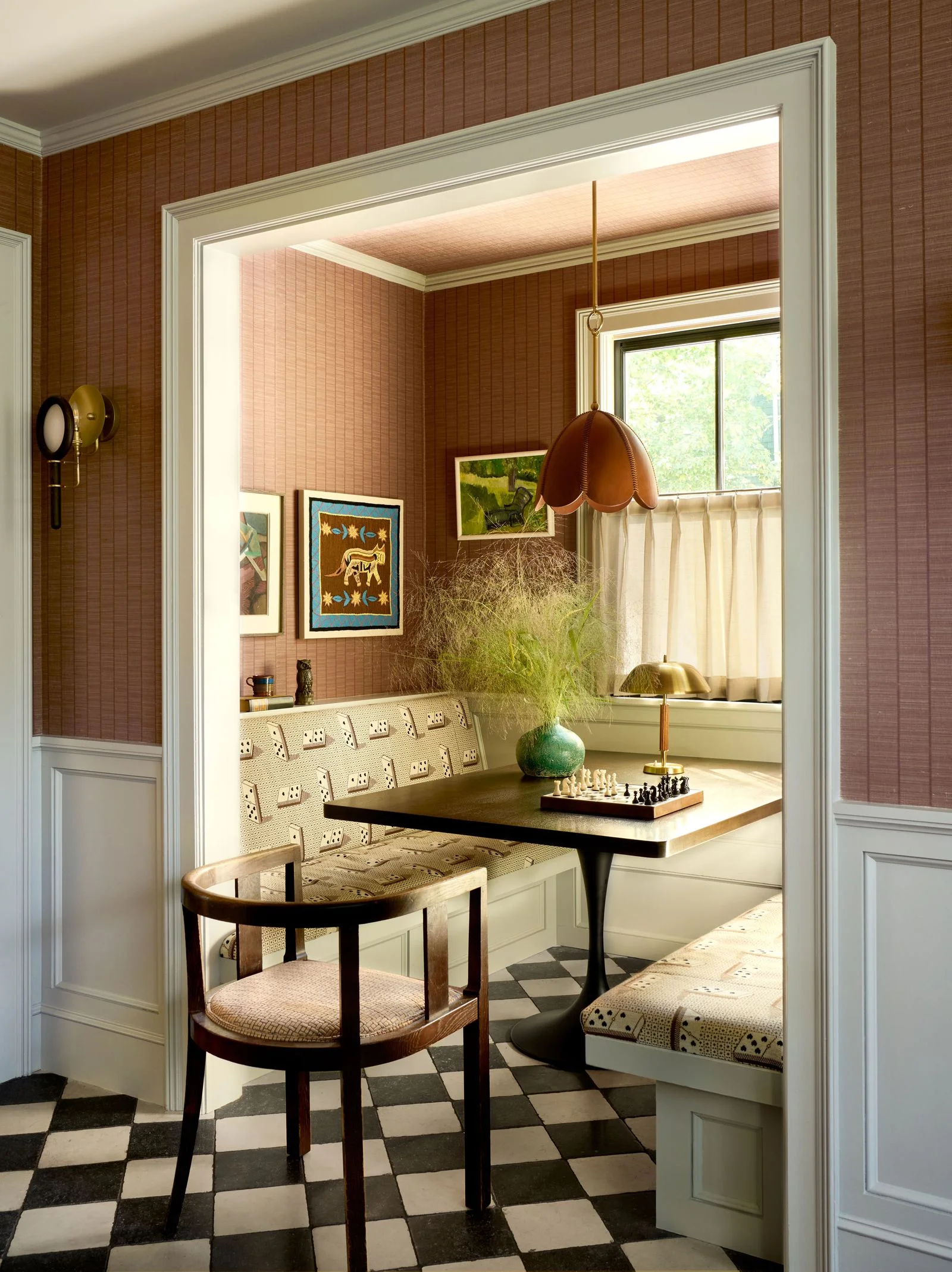 Image may contain Indoors Interior Design Lamp Home Decor Chair Furniture Table Bench Art Painting Door and Desk