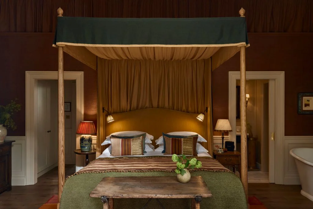 Image may contain Furniture Indoors Interior Design Bed Bedroom Room Lamp Plant and Canopy Bed