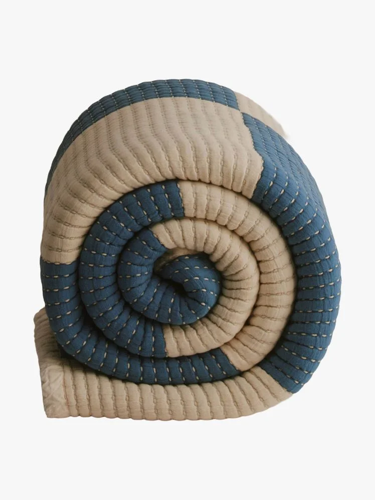 Image may contain: Clothing, Hat, Home Decor, Cap, Coil, and Spiral