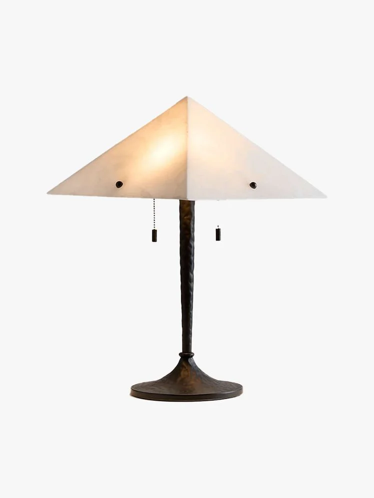 Table lamp with blackened hammered steel base and a triangular alabaster shade.