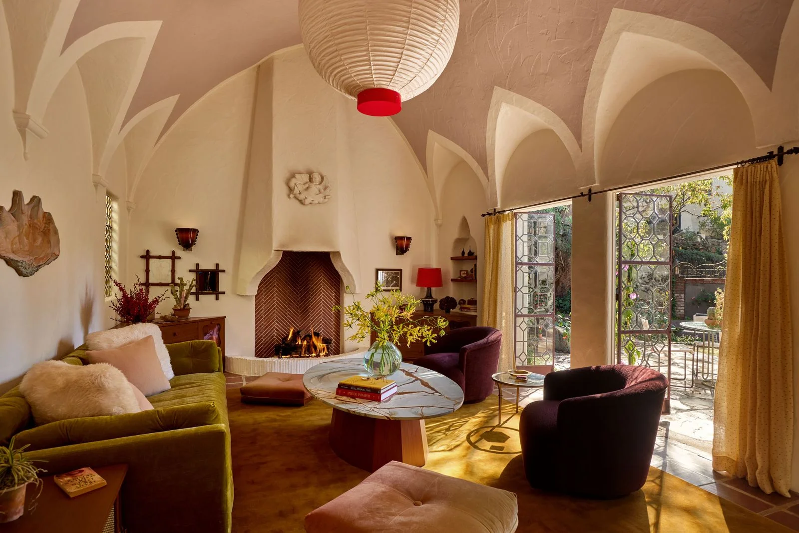 Image may contain Home Decor Architecture Building Furniture Indoors Living Room Room Fireplace Chair and Couch