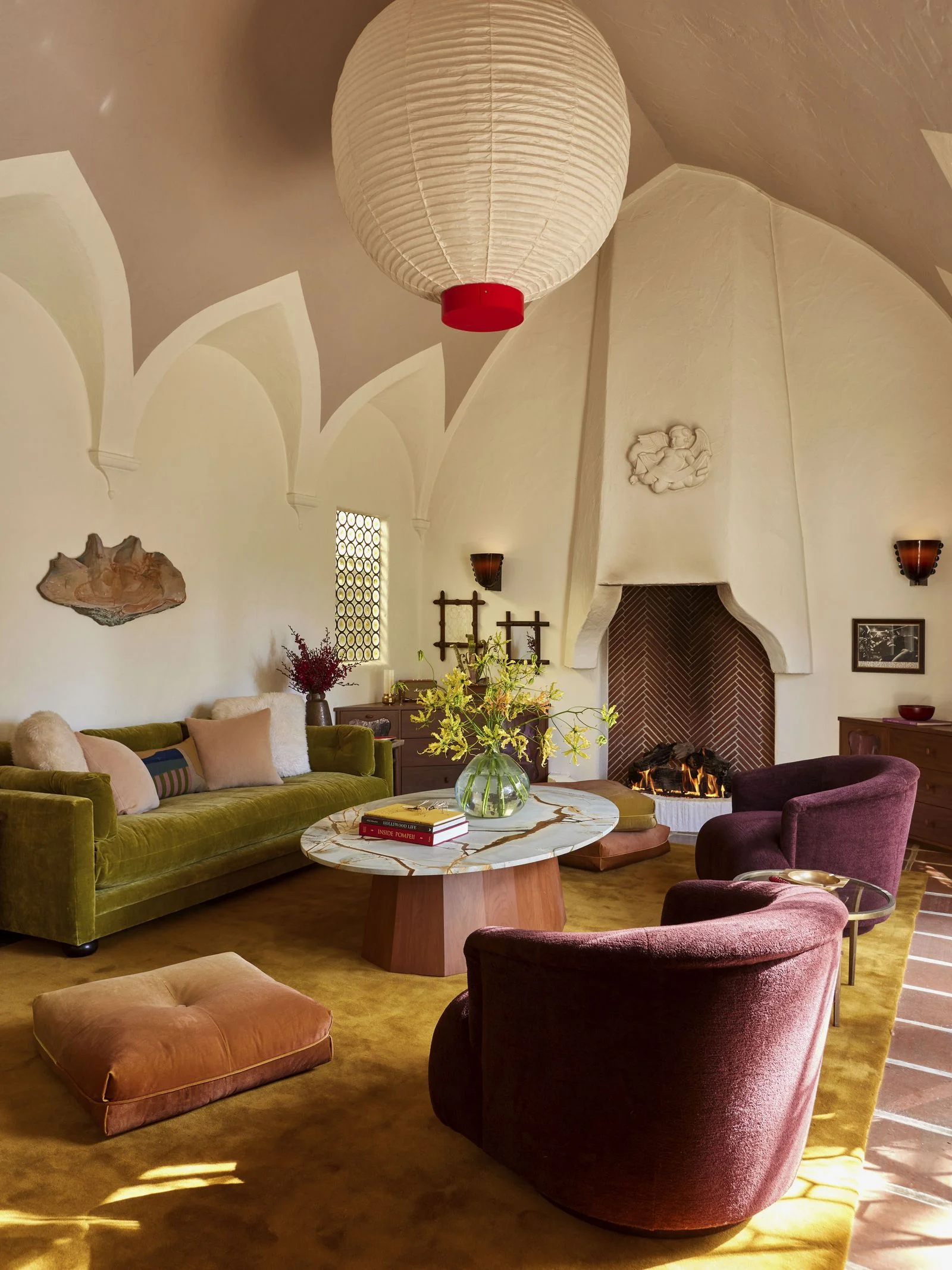 Image may contain Home Decor Architecture Building Furniture Indoors Living Room Room Chair Couch Lamp and Art