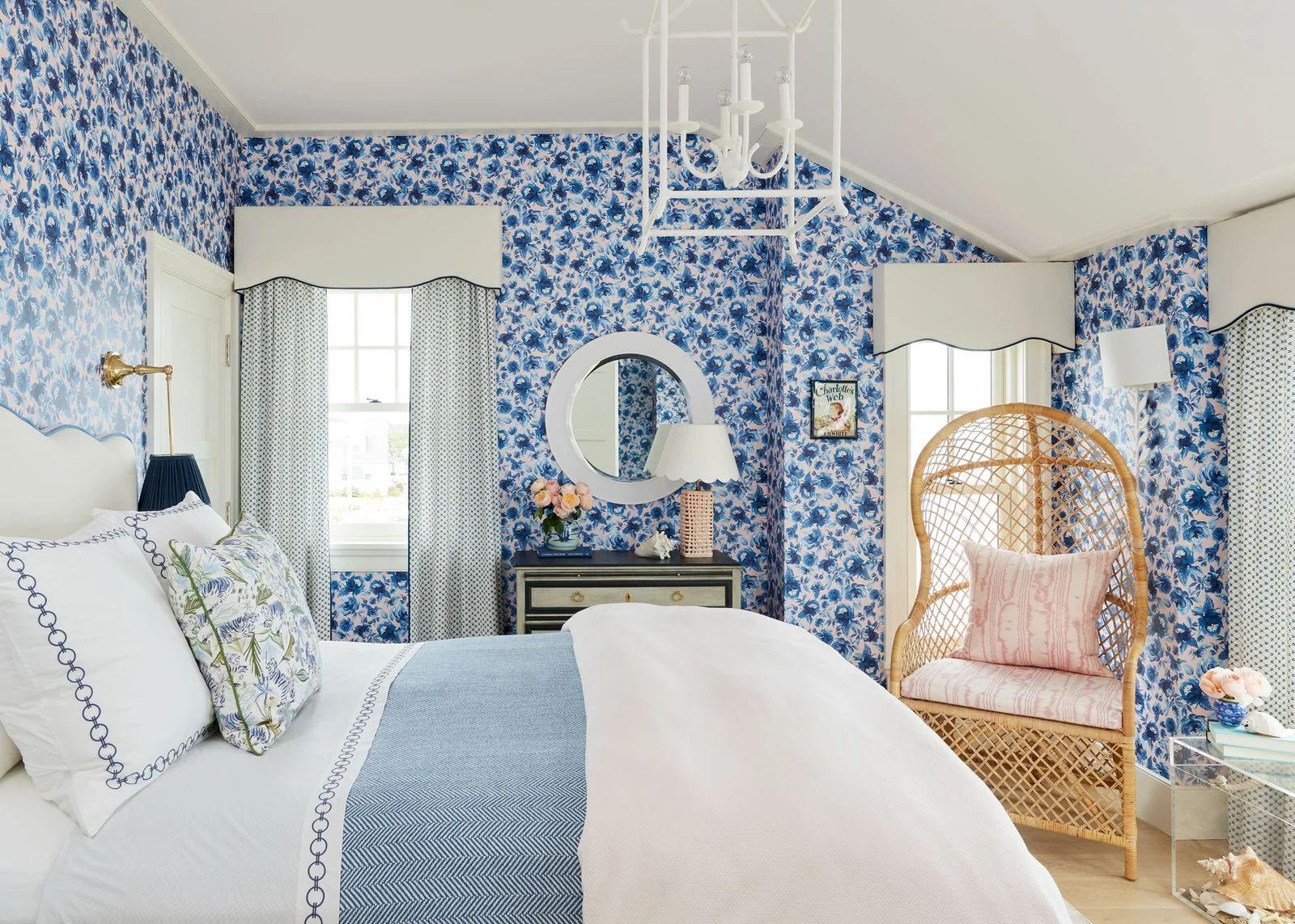 Liz Caan dreamed up a charming blueandwhite coastal bedroom for a clients daughter. “Sweet scallops mimic the waves of...