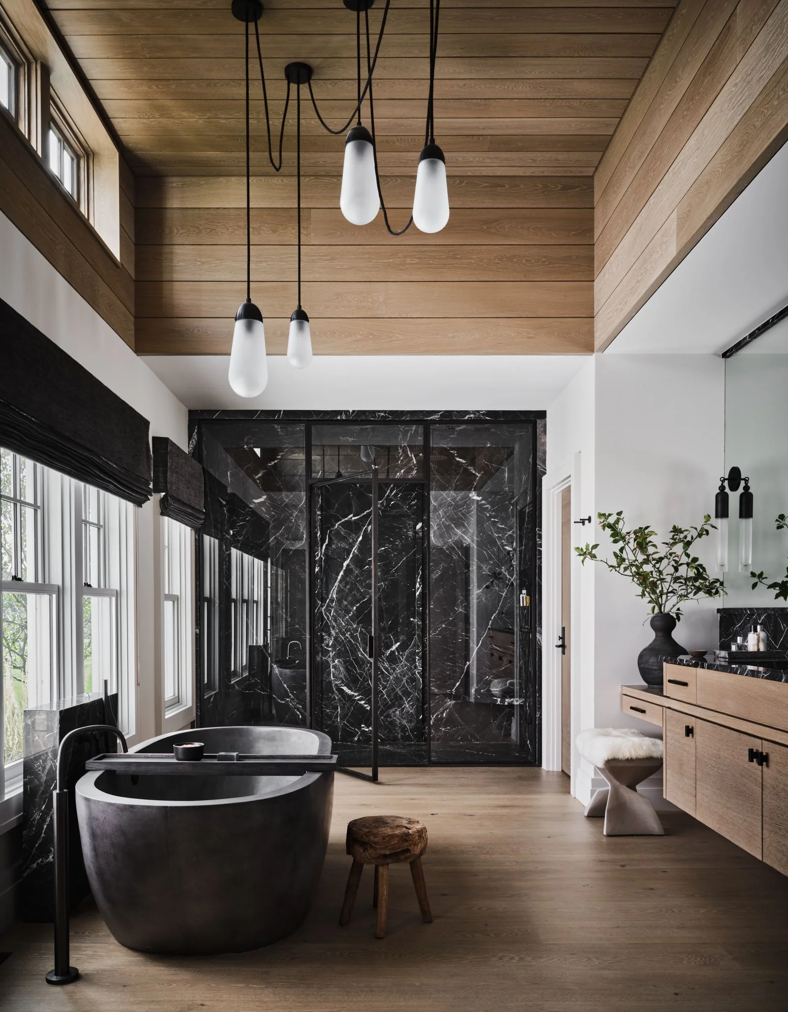 A European white oak ceiling and black Calacatta marble slab organically ground this Nantucket estate by Nicole Hogarty...