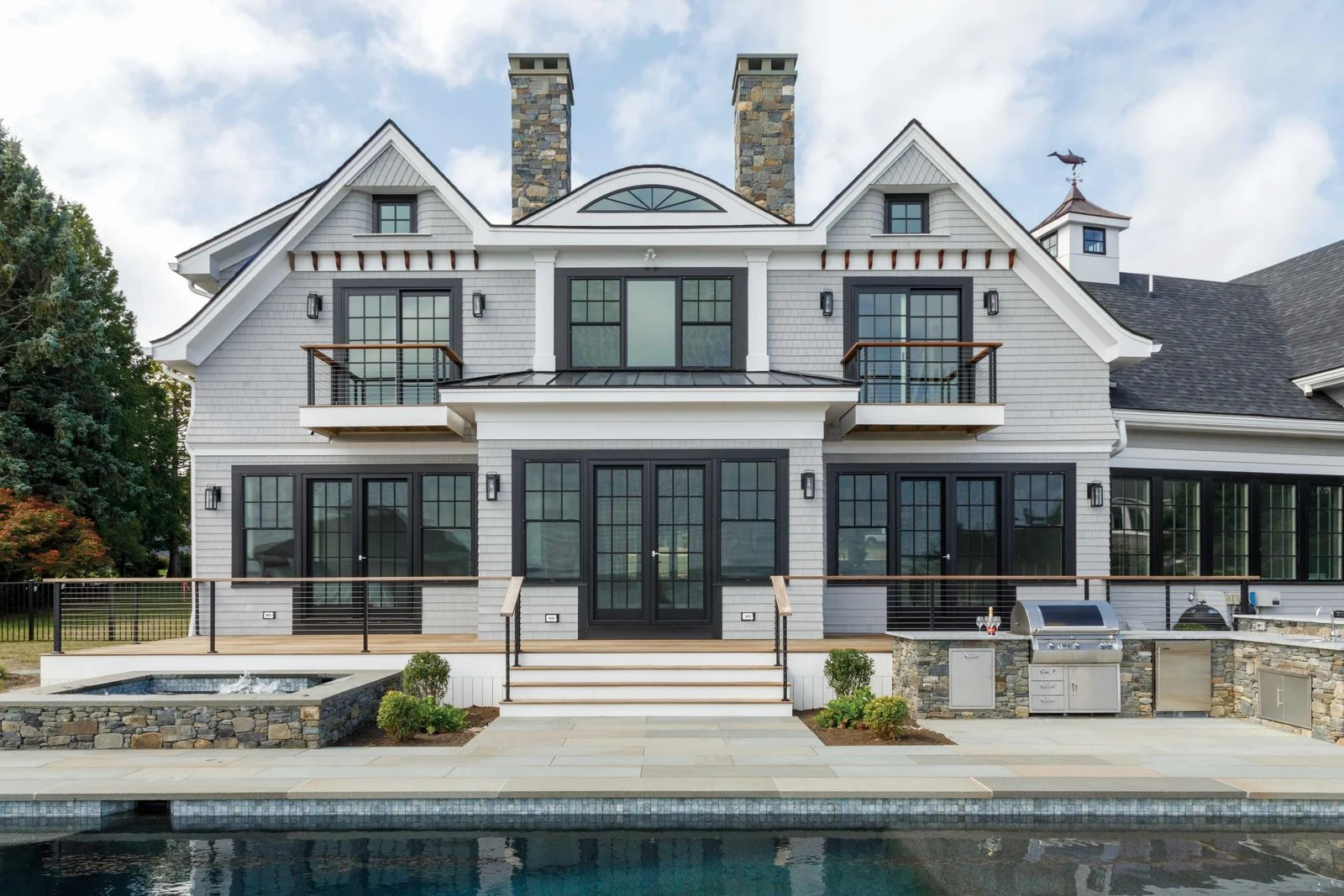 Image may contain Water Waterfront Architecture Building House Housing Villa Condo Door and Pool