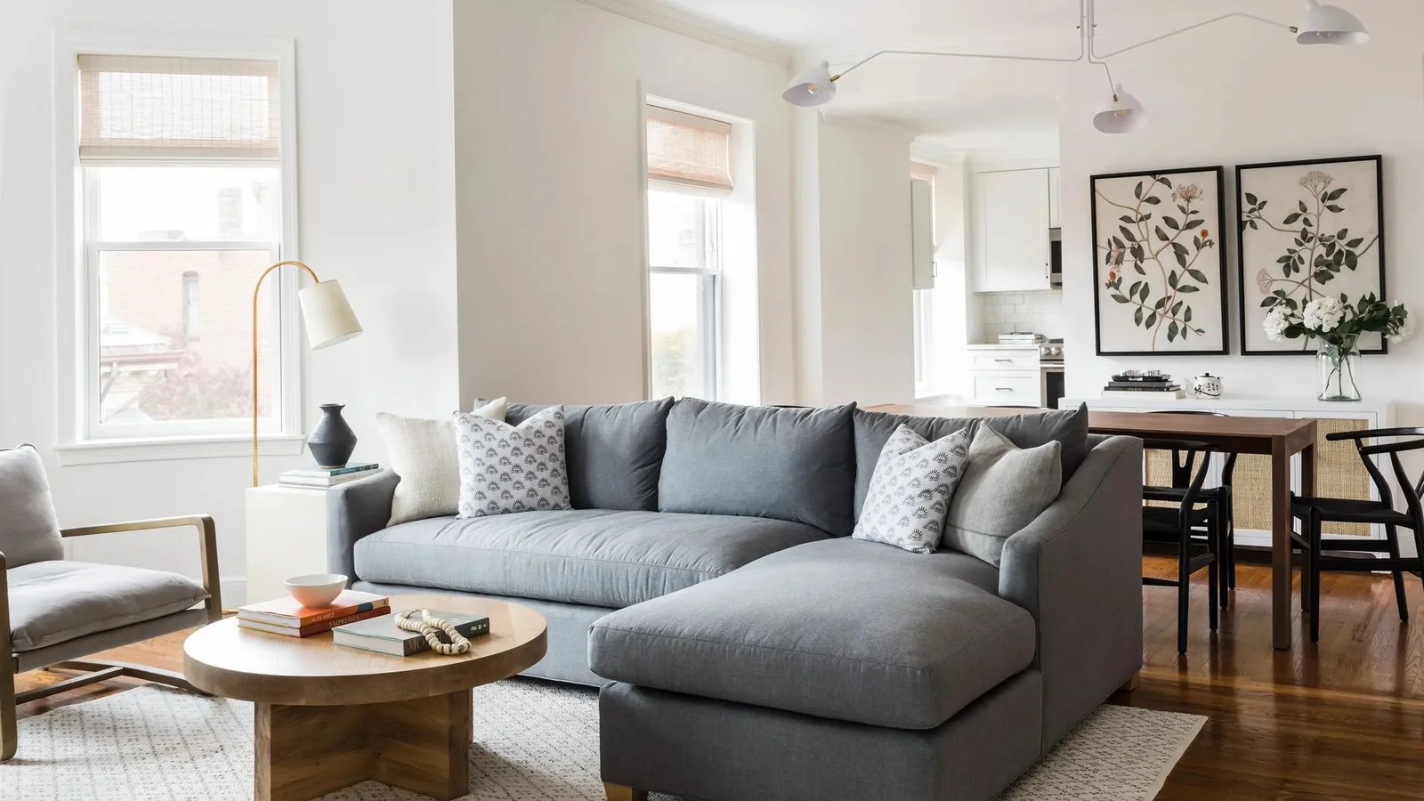 Image may contain Couch Furniture Home Decor Table Architecture Building Indoors Living Room Room and Book