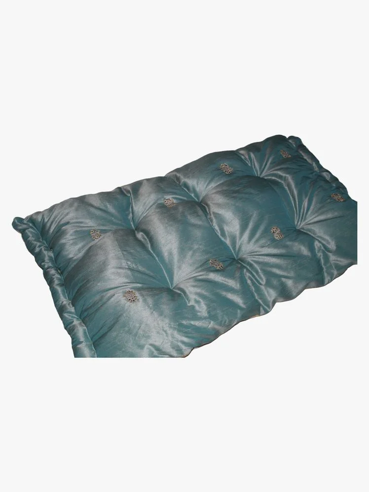 Image may contain: Cushion, Home Decor, Pillow, Blanket, Blouse, Clothing, and Furniture