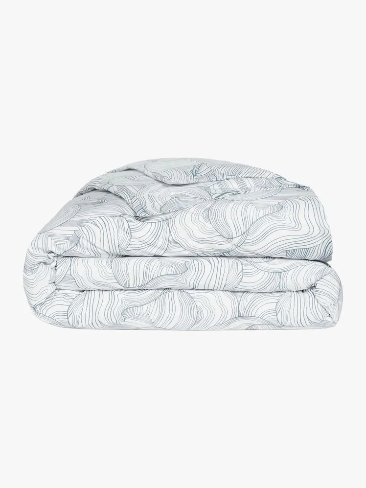 Image may contain: Blanket, Cushion, Home Decor, Furniture, and Bed