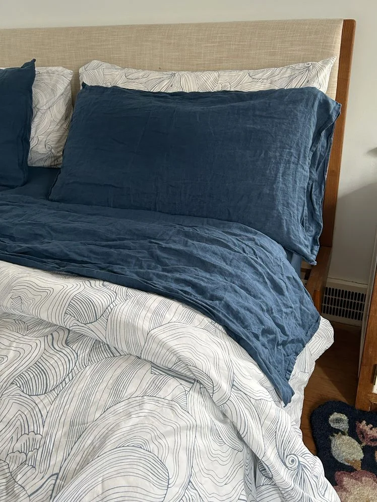 Image may contain: Cushion, Home Decor, Pillow, Bed, Furniture, Rug, and Bed Sheet