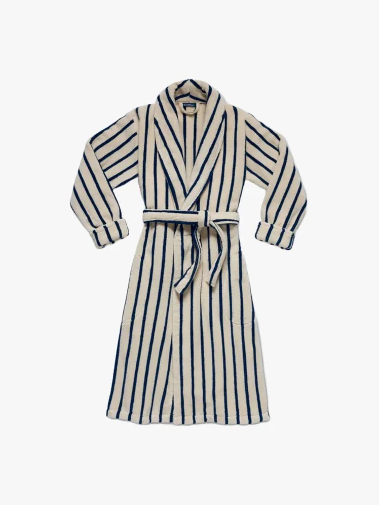 Image may contain: Fashion, Clothing, Robe, Coat, and Skirt