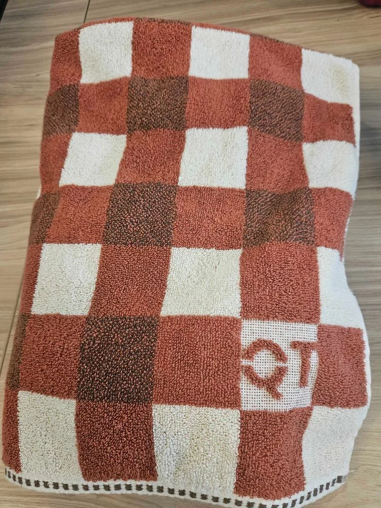 Bath towel with brown checkered design.