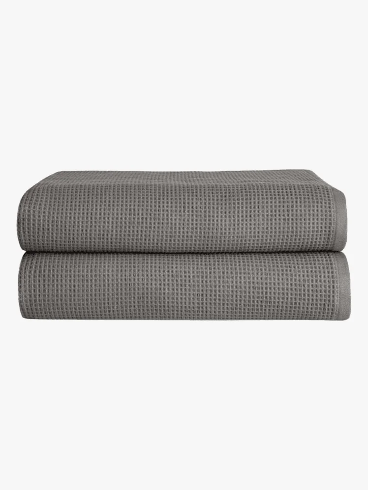 Set of two folded gray Waffle Bath Towels.