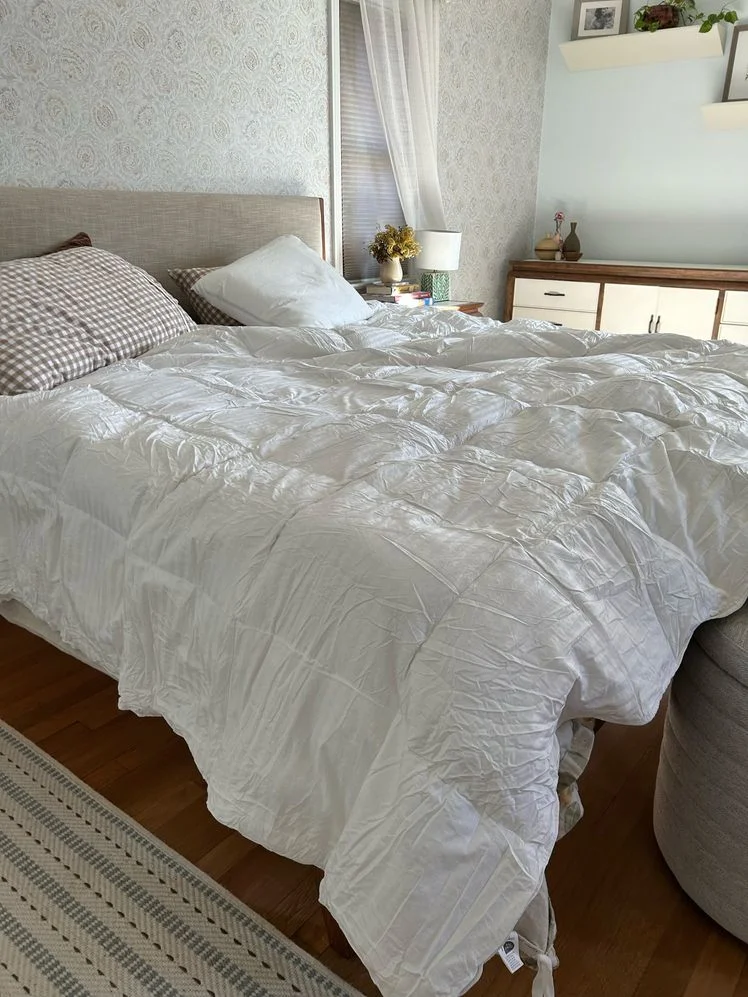 White square stitch duvet on a bed.
