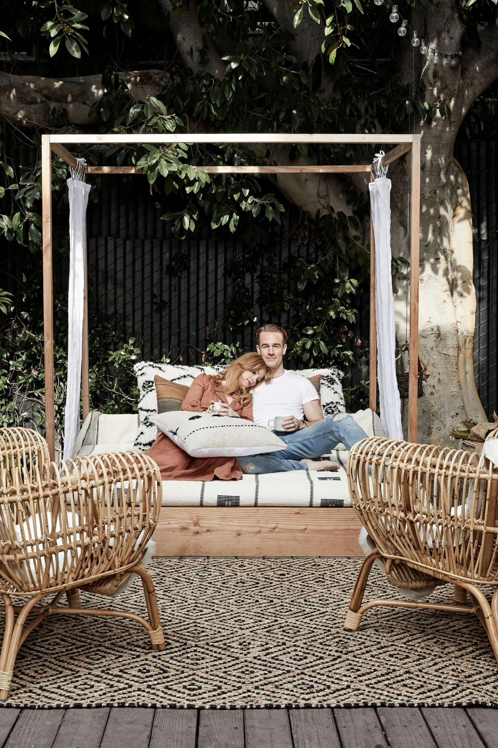 a couple snuggles outside