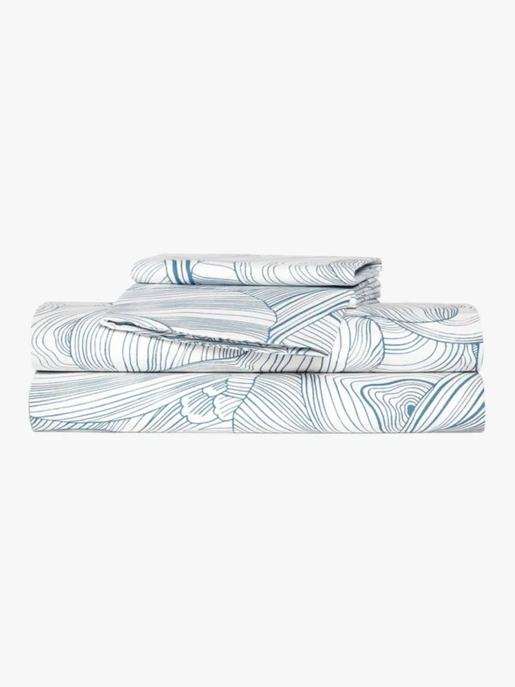 Image may contain: Furniture, Blanket, and Bed