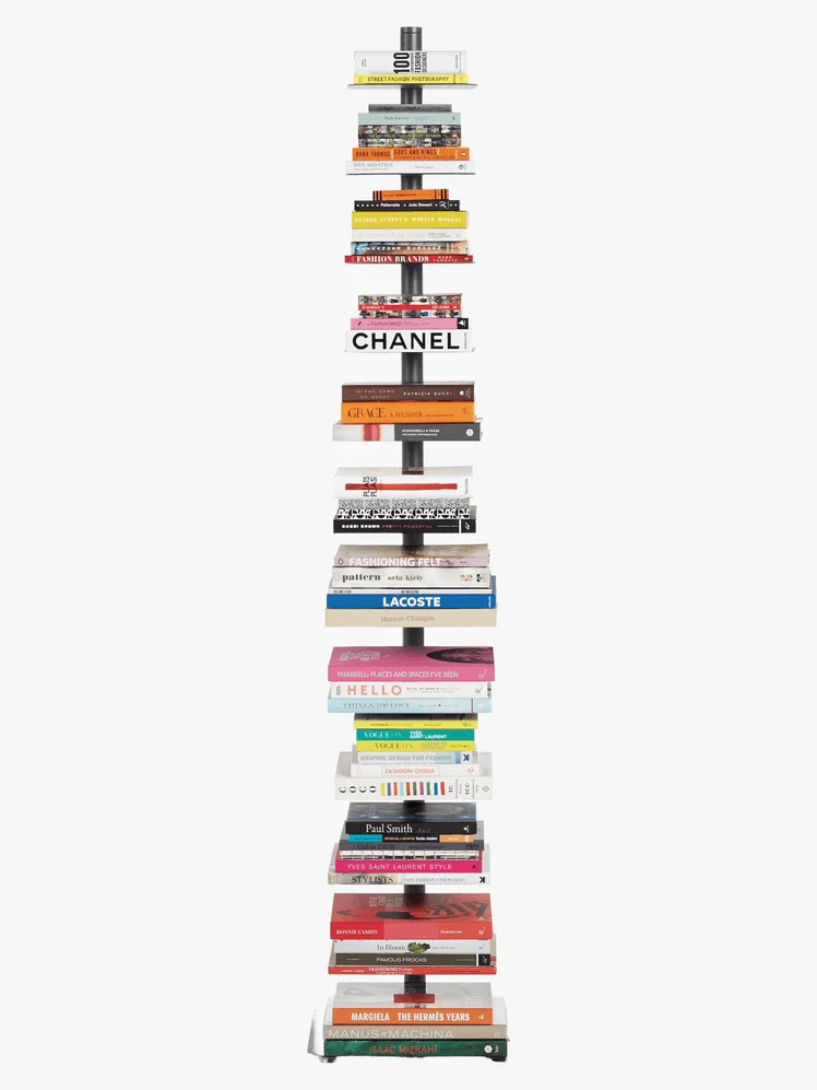 Vertical bookcase with various books on it.