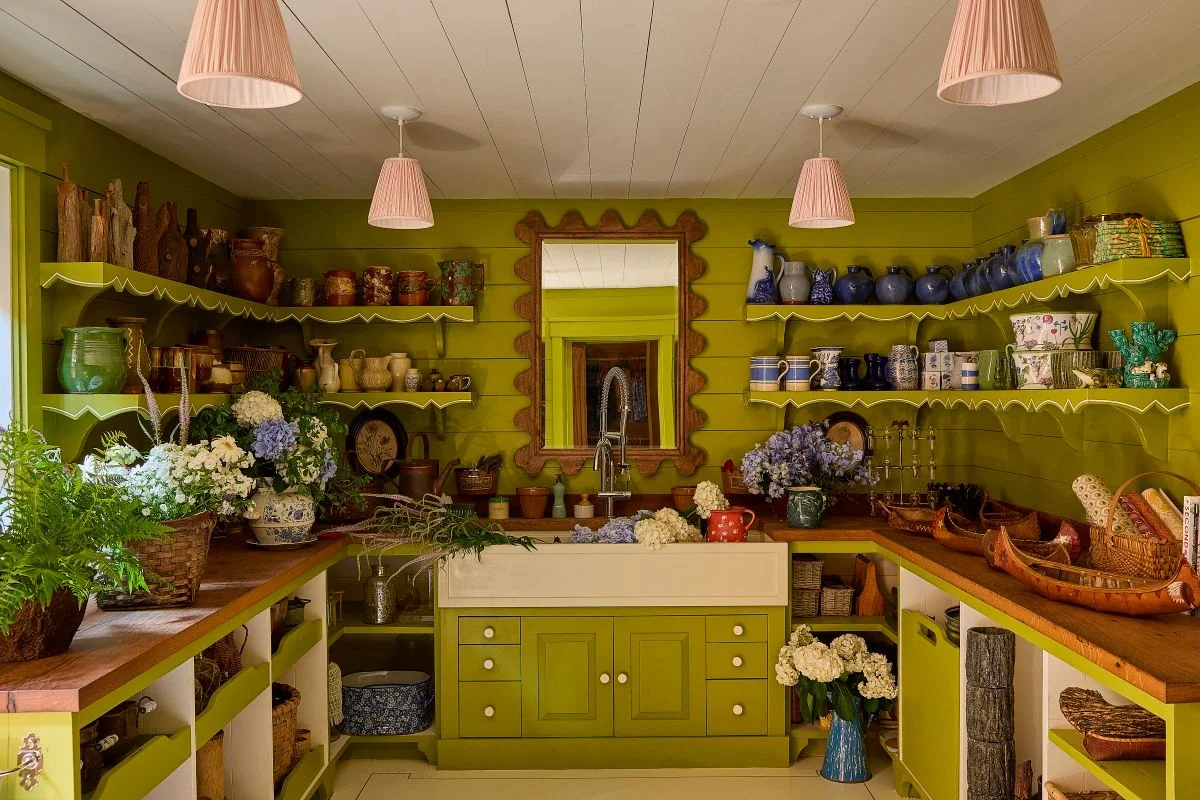 Image may contain Lamp Indoors Interior Design Plant Shelf Home Decor Kitchen Sink Sink Faucet Flower and Cup