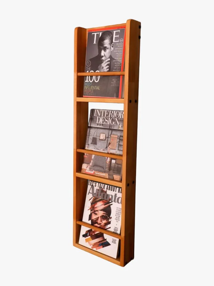 Image may contain: Jay-Z, Furniture, Adult, Person, Publication, Shelf, Bookcase, Face, and Head
