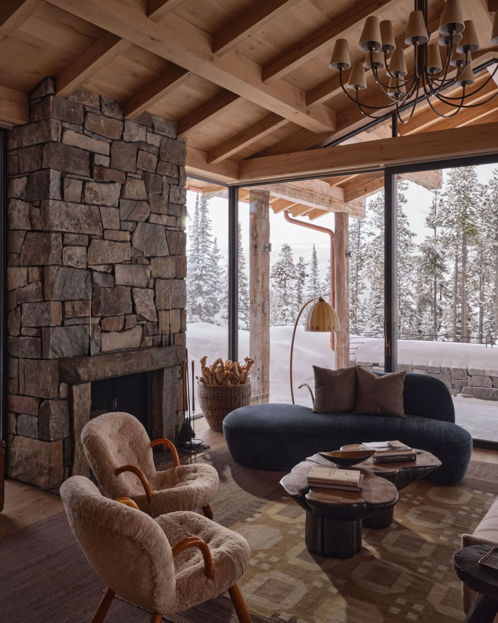 Image may contain Home Decor Indoors Interior Design Chair Furniture Fireplace Couch Book and Publication