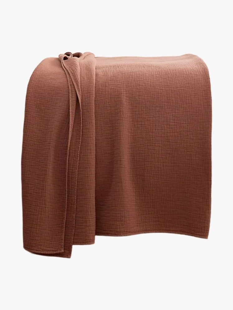 Image may contain: Blanket, and Home Decor