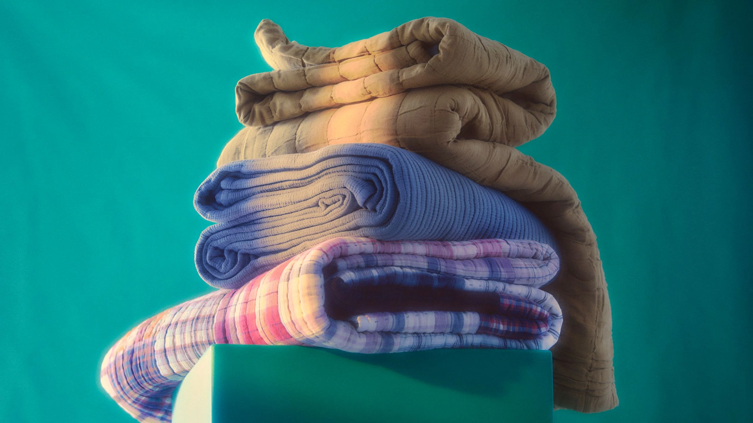 Image may contain Chair Furniture Towel and Blanket