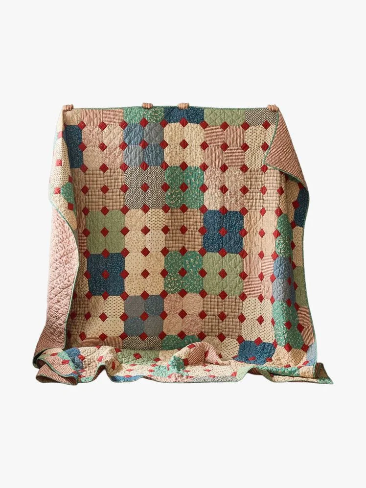 Image may contain: Cushion, Home Decor, Patchwork, Blanket, Quilt, Clothing, and Vest