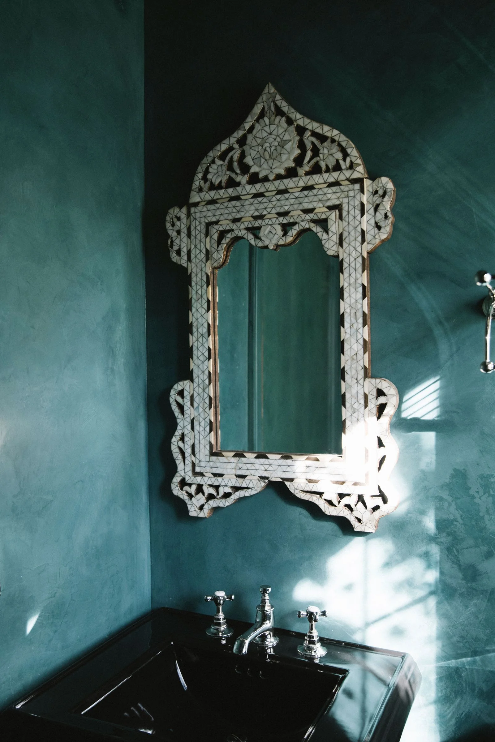 Image may contain Mirror Sink and Sink Faucet