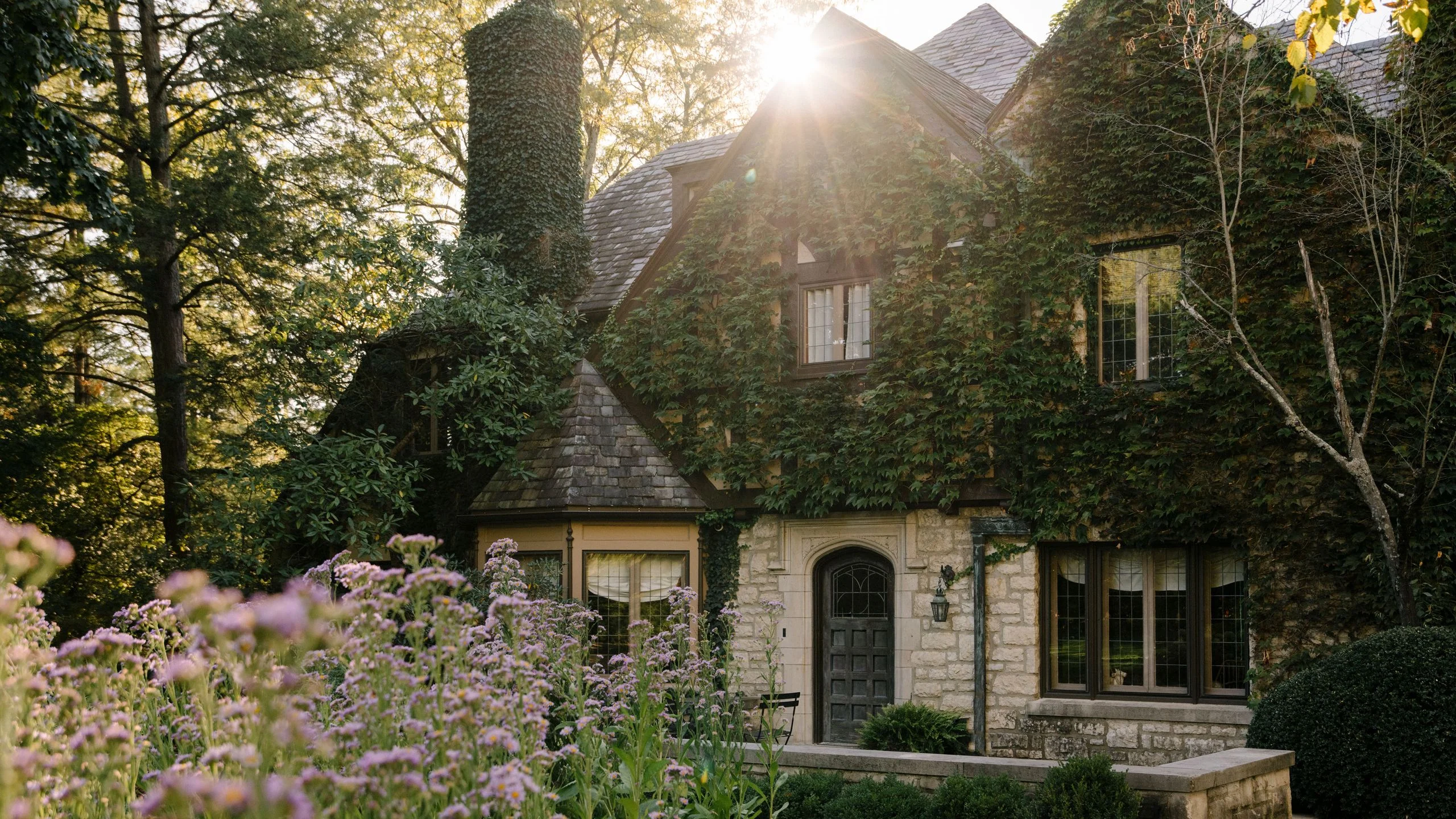 Image may contain Tudor Revival Architecture Building Cottage House Housing Grass Plant Vegetation Garden Nature and...