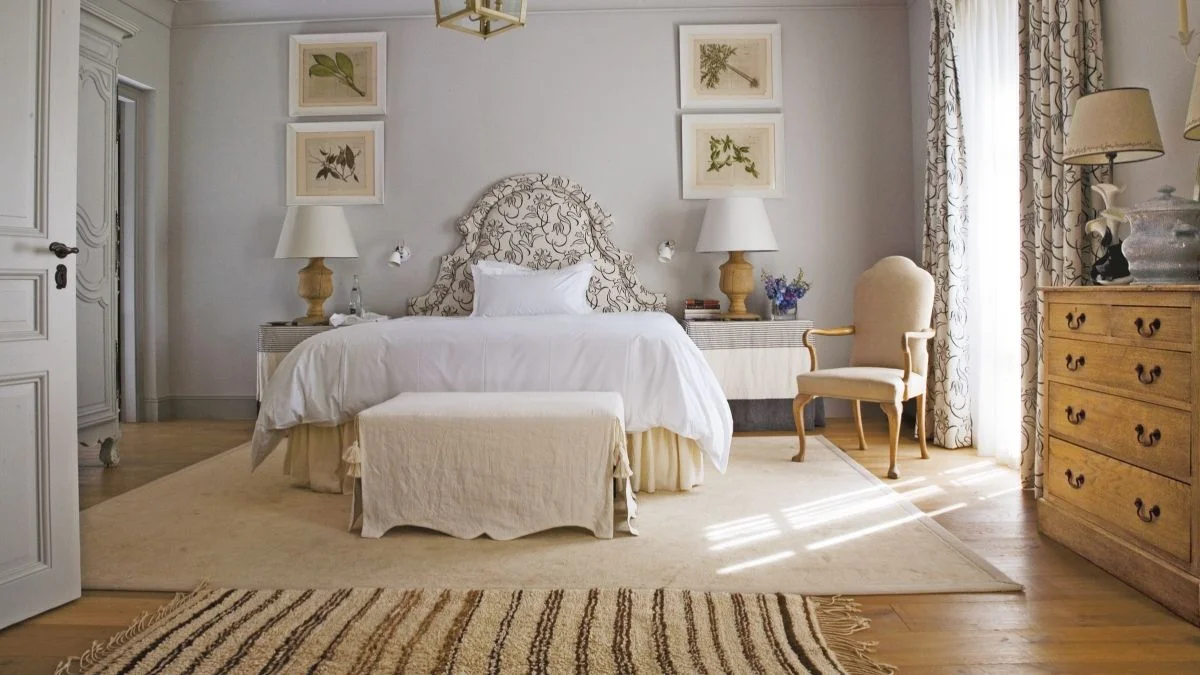 Image may contain Home Decor Lamp Chair Furniture Rug Bed Bench Art Painting Indoors Interior Design and Bedroom