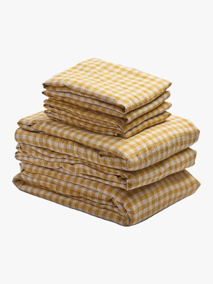 Stack of yellow gingham sheets.